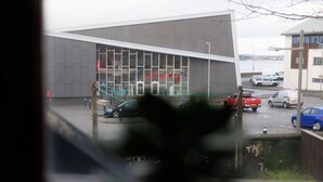 A modern building with large windows and a visible sign that reads "MARC". - NEW to VRBO: Central Lerwick 2Bed Apt · Garden|Walk to Sights (Lerwick)
