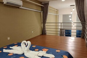 A hotel room with a bed, a balcony, and a view of the city. - The CEO Suite7 by Homey Planet (Bayan Lepas)