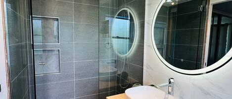 Shower, hair dryer, towels, soap