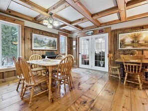 Dining - Escape to Three  Bears Cottage, a cozy cedar-lined cottage just two blocks from Lake Huron. Enjoy evenings by the fireplace, mornings on the wrap-around porch, and peaceful moments surrounded by nature on the beautiful Bruce Peninsula. (Wiarton)