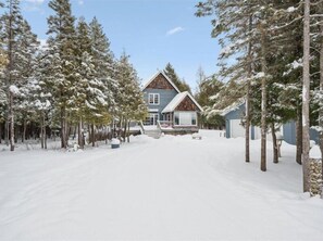 Exterior - Escape to Three  Bears Cottage, a cozy cedar-lined cottage just two blocks from Lake Huron. Enjoy evenings by the fireplace, mornings on the wrap-around porch, and peaceful moments surrounded by nature on the beautiful Bruce Peninsula. (Wiarton)