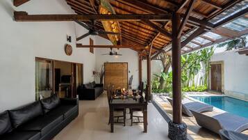 Villa, Pool View | Living area | Flat-screen TV