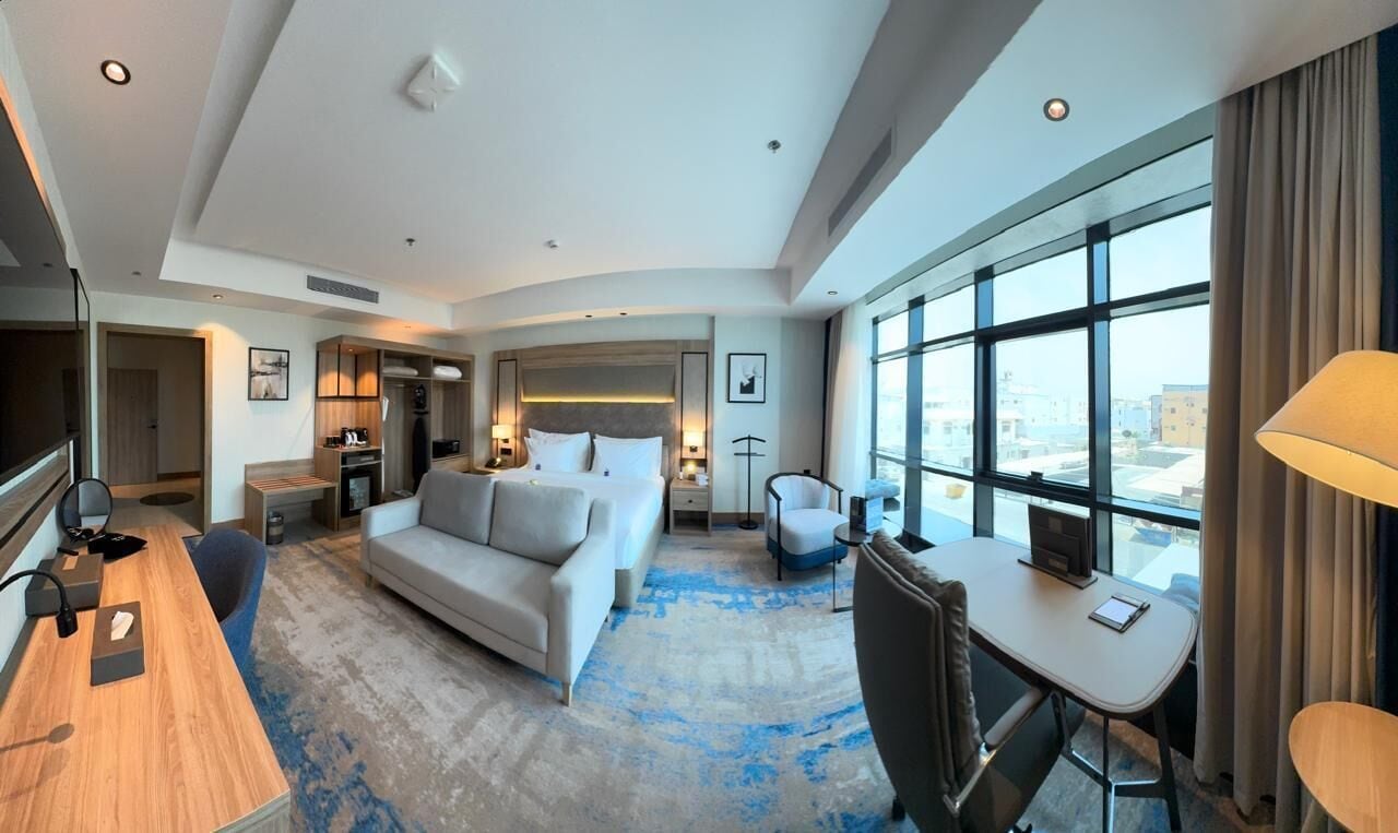 Deluxe Suite, City View | In-room safe, laptop workspace, iron/ironing board, free WiFi