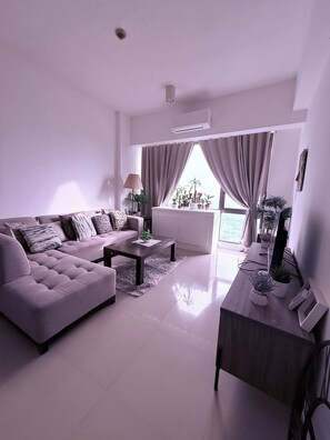 Living room - Luxurious Taguig Apartment With Private Pool and Central AC (Taguig)