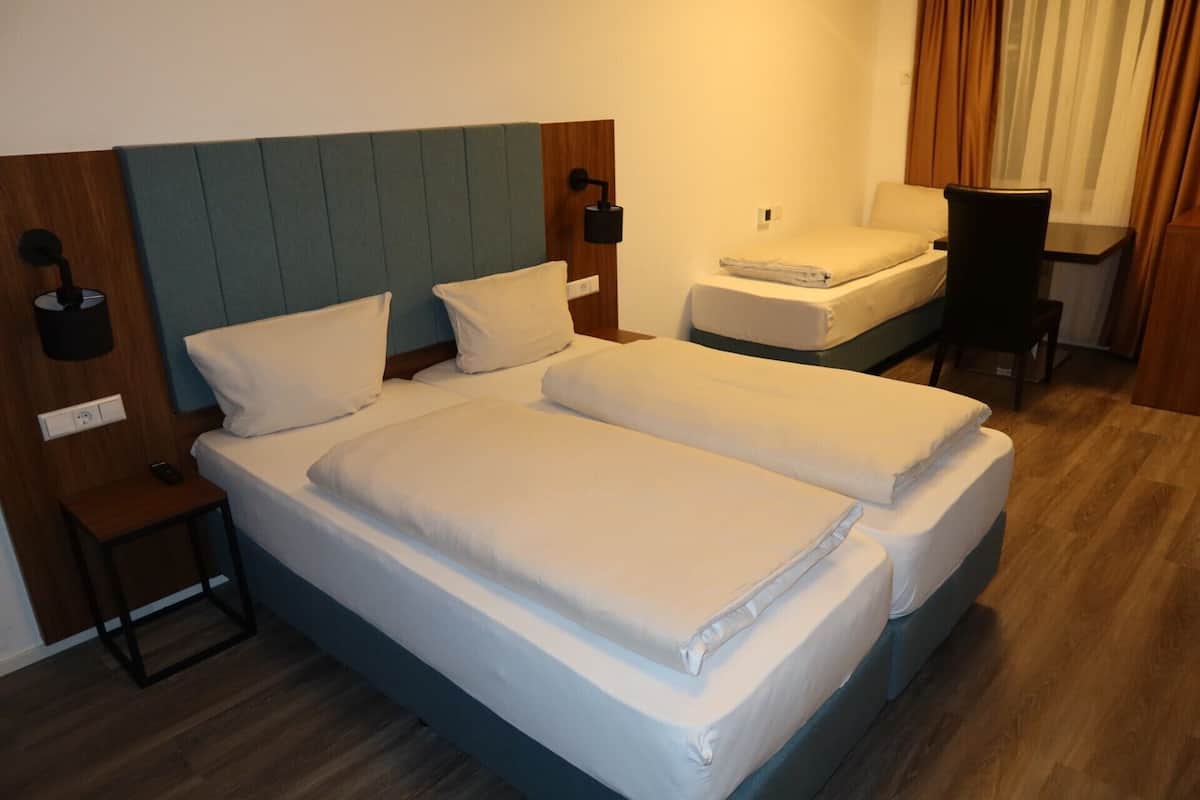 Deluxe Triple Room, Non Smoking | Blackout curtains, soundproofing