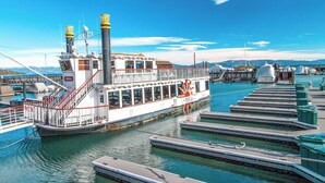 A riverboat docked at a marina with a clear view of the mountains in the background. - 1BR Condo w/ Access to Resort Pools, Spa & Gym (Olympic Valley)