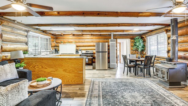 A log cabin interior with a kitchen, dining area, and living room. - MTB Base Camp! Rustic Cabin By Mt Laguna Trails (Mount Laguna)