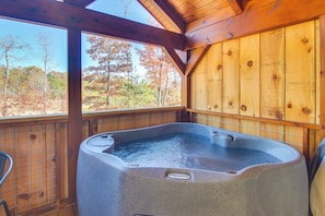 A hot tub in a wooden cabin with a view of autumn trees. - Sweet Thang: Romantic Blue Ridge Mtns Getaway (Union Mills)