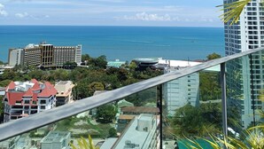 A high-rise hotel with a view of the ocean and other buildings. - Peaceful SEA View Condo (Pattaya)