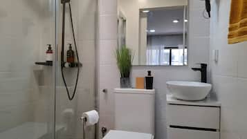 Shower, hair dryer, towels