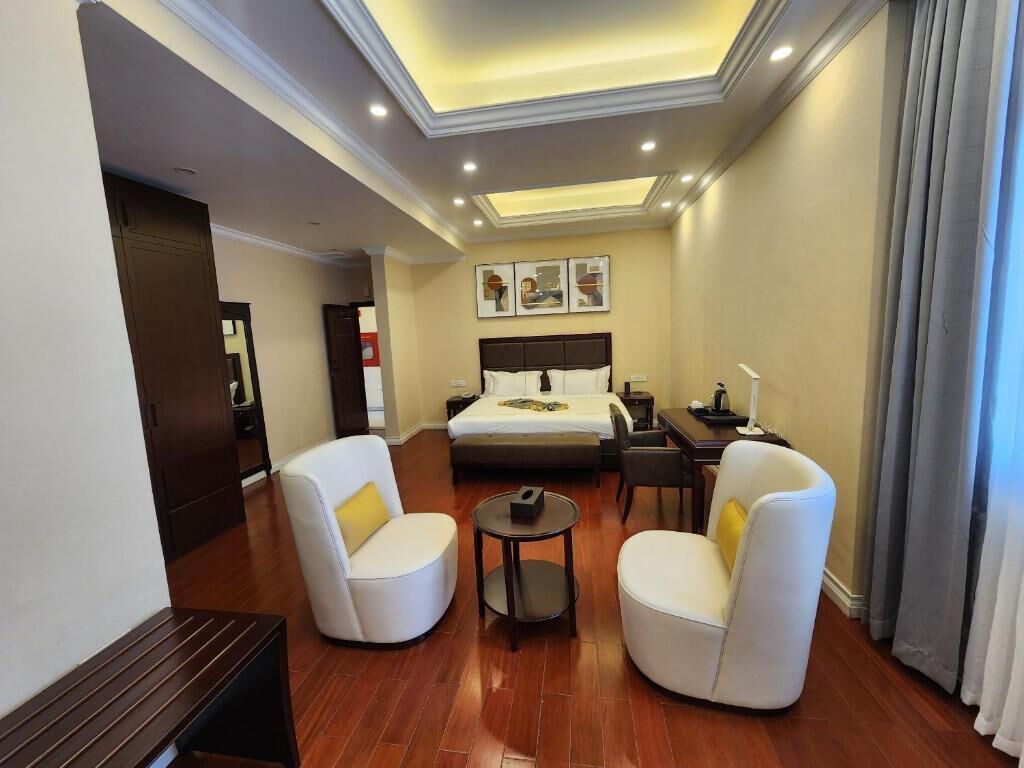 Deluxe Double Room, Balcony, City View | In-room safe, desk, laptop workspace, iron/ironing board