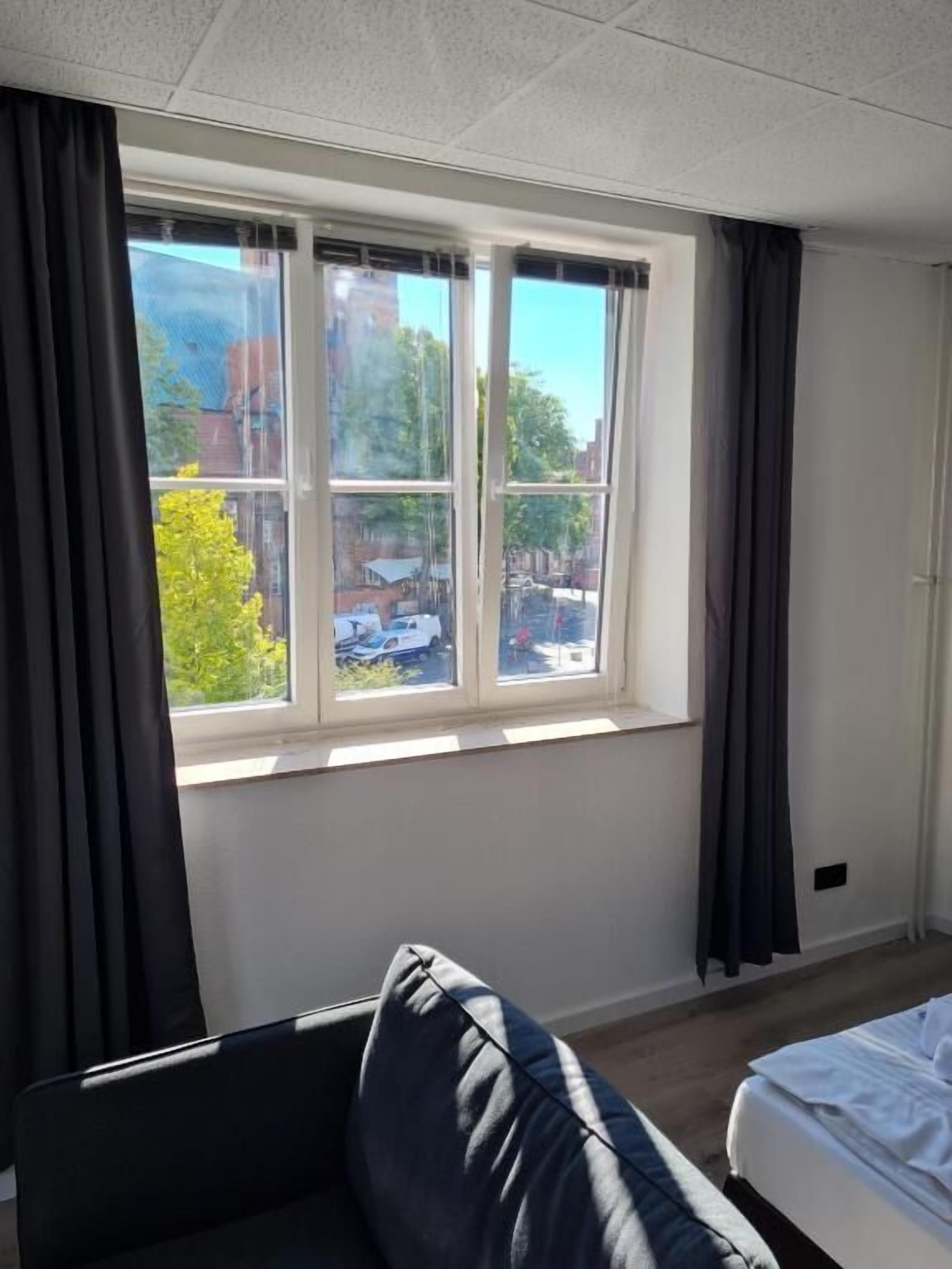 Habitación familiar, vistas a la ciudad | Caja fuerte y wifi gratis