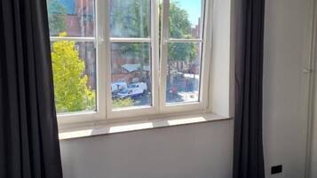 Habitación familiar, vistas a la ciudad | Caja fuerte y wifi gratis