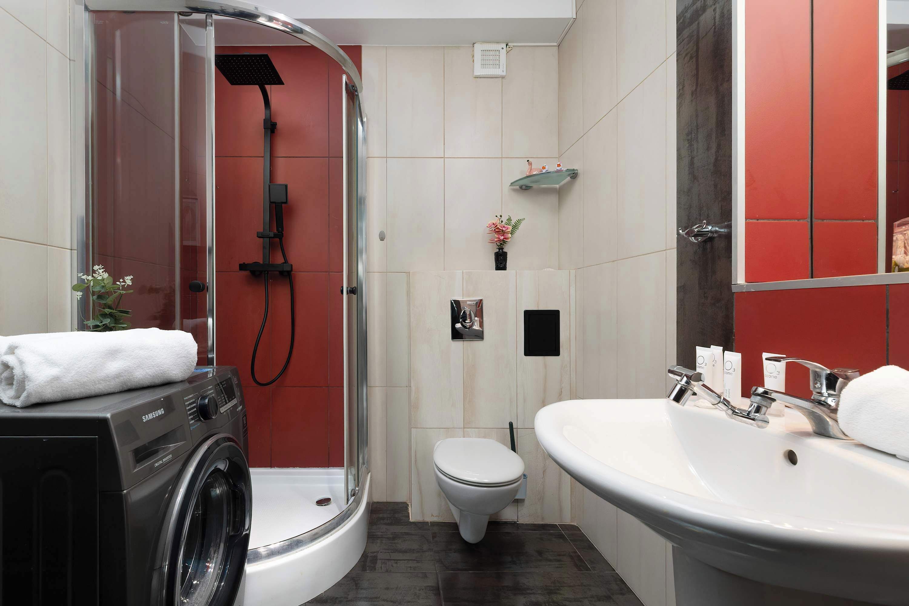 Shower, hair dryer, towels, shampoo