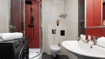 Shower, hair dryer, towels, shampoo