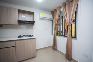 Superior Studio, City View | Private kitchen | Stovetop, dishwasher, cookware/dishes/utensils - Apartahotel Ces (Medellin)