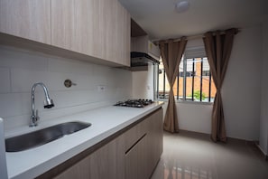 Superior Studio, City View | Private kitchen | Stovetop, dishwasher, cookware/dishes/utensils - Apartahotel Ces (Medellin)