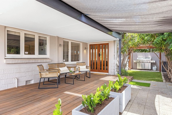 Get ready for perfect alfresco dining! Our covered timber deck features comfortable seating and a BBQ grill, making summer cookouts and evening lounging a must-do.