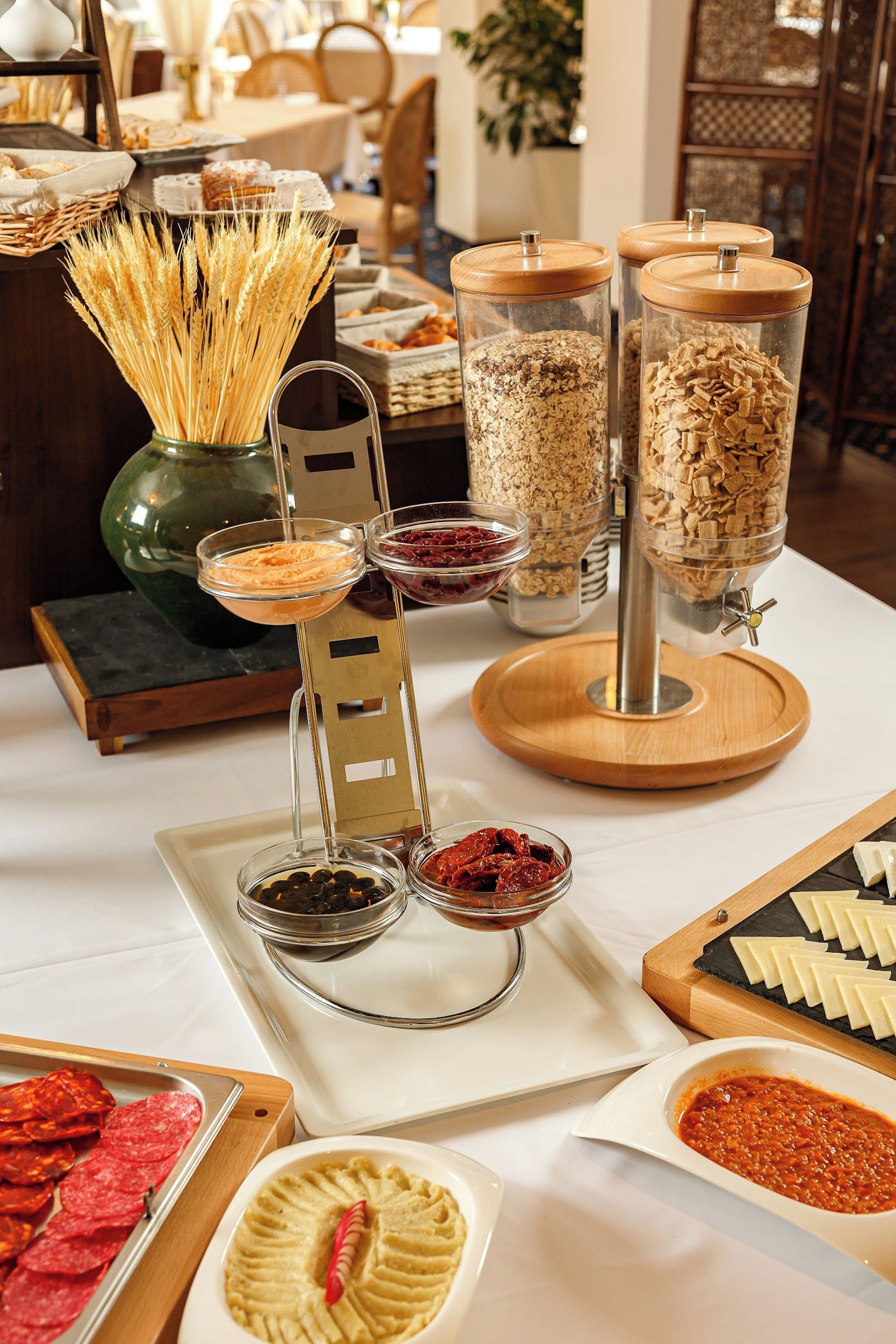 A buffet setup with various food items and condiments.
