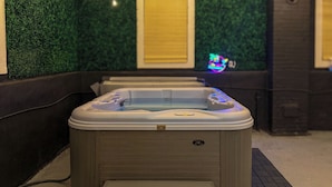 A hot tub with a control panel and a step for access. - Cozy Winter Escape - Hot Tub, Game Room, Fireplace, Sleeps 6 (Waterbury)