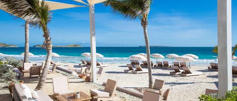 On the beach, sun loungers, beach towels