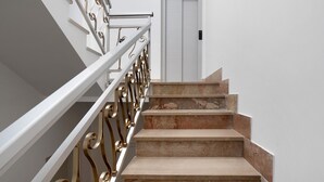 A staircase with a white railing and beige steps. - Room 'Camera 1 - P2' with Balcony, Wi-Fi and Air Conditioning (Balestrate)