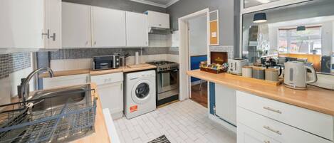 Microwave, coffee/tea maker, dining tables