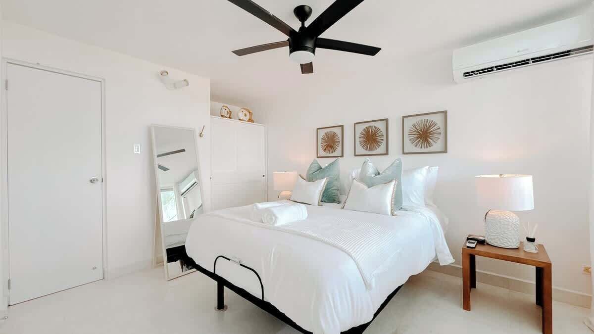 The bedroom comfortably sleeps up to 2 guests in a dreamy queen-size reclining bed and features AC, closet space and blackout curtains.