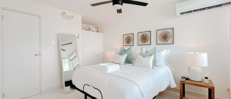 The bedroom comfortably sleeps up to 2 guests in a dreamy queen-size reclining bed and features AC, closet space and blackout curtains.