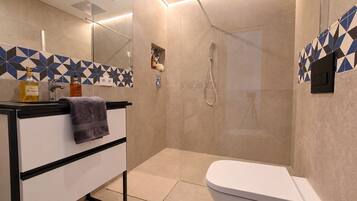 Shower, jetted tub, hair dryer, bidet