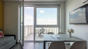 Departamento Deluxe, Terraza, vista a la ciudad | Área de sala de estar