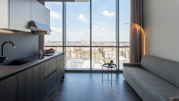 Departamento Deluxe, vista a la ciudad | Área de sala de estar