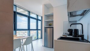 Departamento Deluxe, vista a la ciudad | Cocina privada
