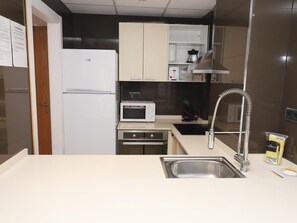 Fridge, microwave, oven, coffee/tea maker - Royal Apartments: Modern Stay with Pool, Terrace & A/C, 500m from Levante Beach, Near Port Aventura (Salou)