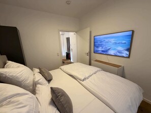 Fer et planche à repasser, lit parapluie, Wi-Fi, draps fournis