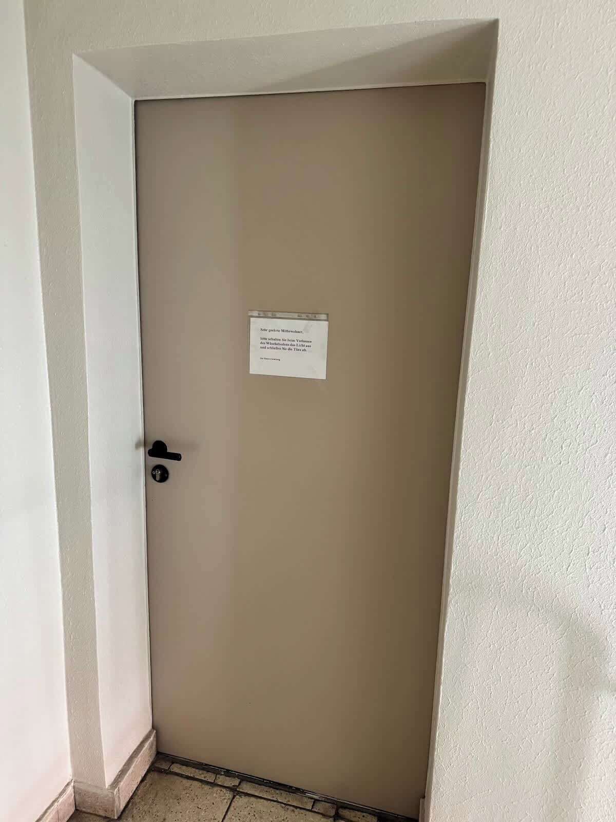 A closed door with a sign on it.