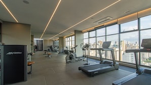 A gym with treadmills, stationary bikes, and weight machines. - Near Allianz Parque Sp-p1803b (São Paulo)