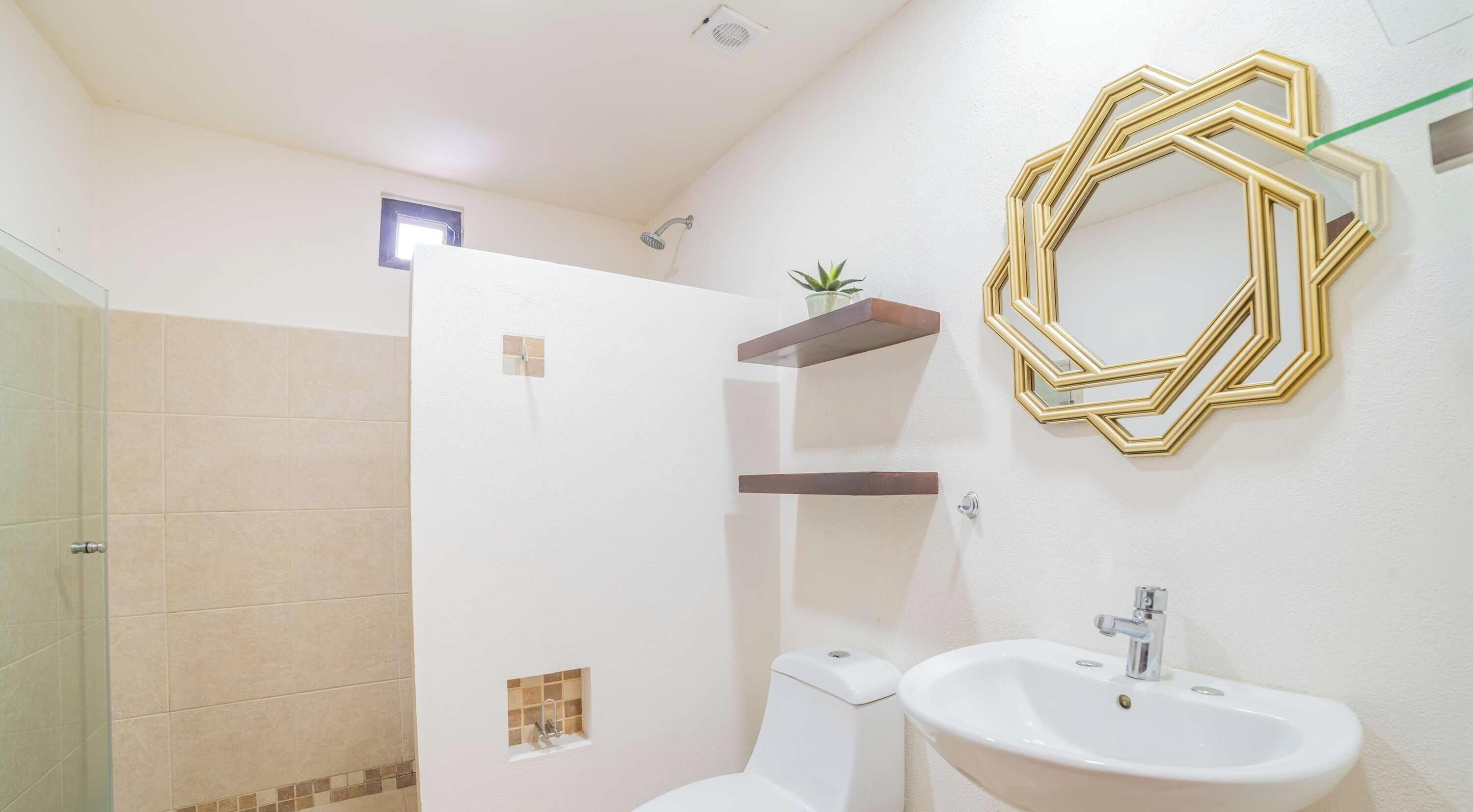 Shower, hair dryer, towels, shampoo
