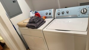 A laundry area with two washing machines and a dryer. - 2-bedroom house in wonderful Demopolis with cool AC (Demopolis)
