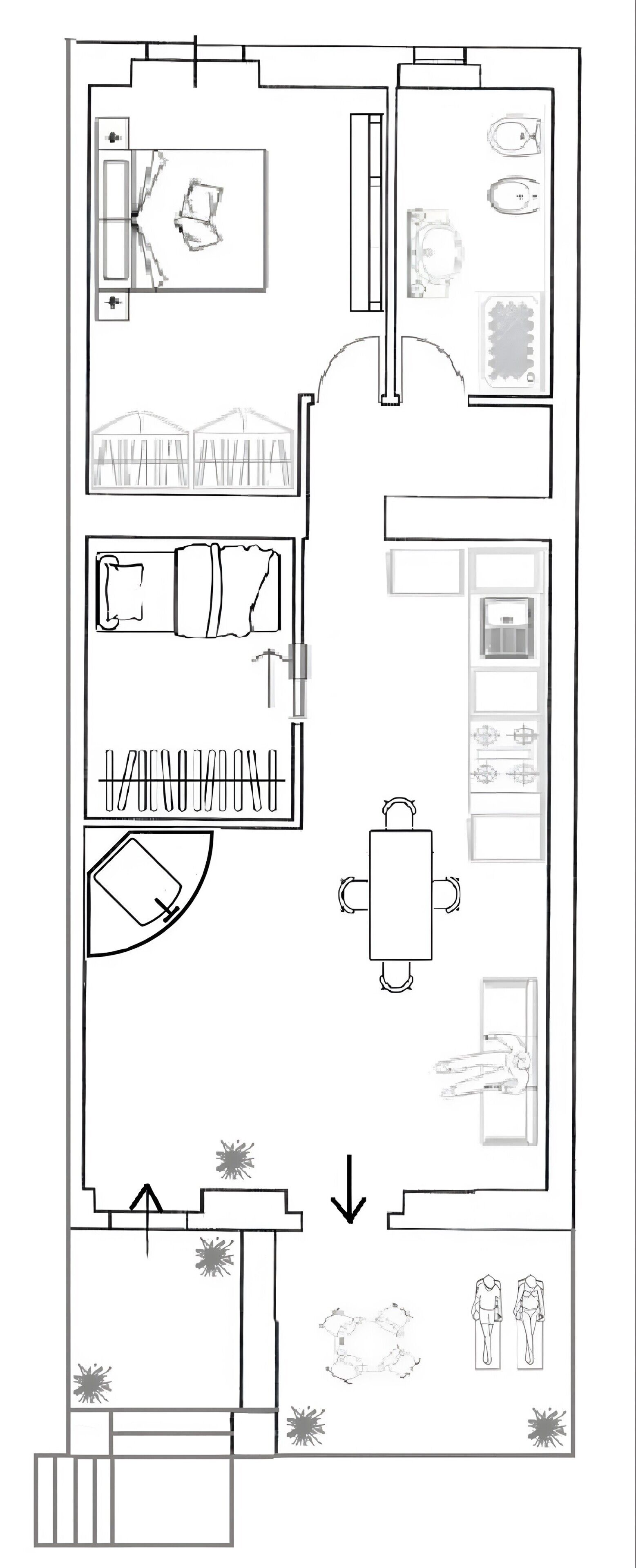 Grundriss eines Hotels mit Küche, Essbereich und einem Schlafzimmer mit großem Bett.