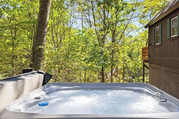 Relax in the private hot tub and enjoy fresh mountain air after a day of exploring.
