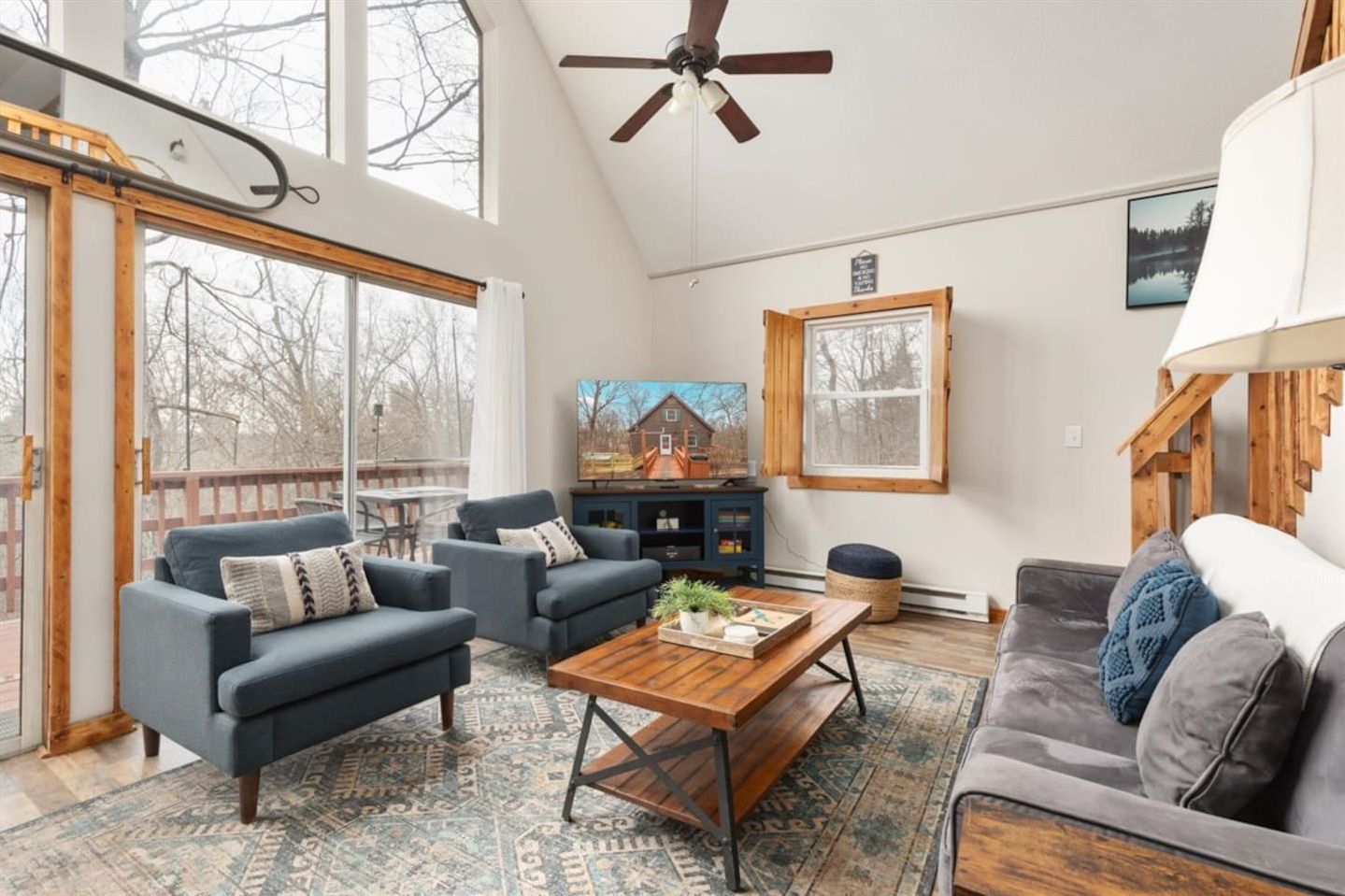 Gather and relax in the bright, airy living room flooded with natural light and a large Roku smart TV. 