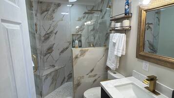 Shower, hair dryer, towels, soap