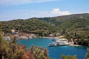 A coastal town with a marina, surrounded by hills and dense greenery. - Ortikia - Four Bedroom Villa, Sleeps 8 (Lefkada City)