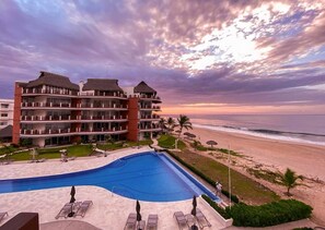 Outdoor pool - 2 Bedroom Ocean Front Condo. 180º ocean views, steps from the beach and pool. (Bajos de Chila)