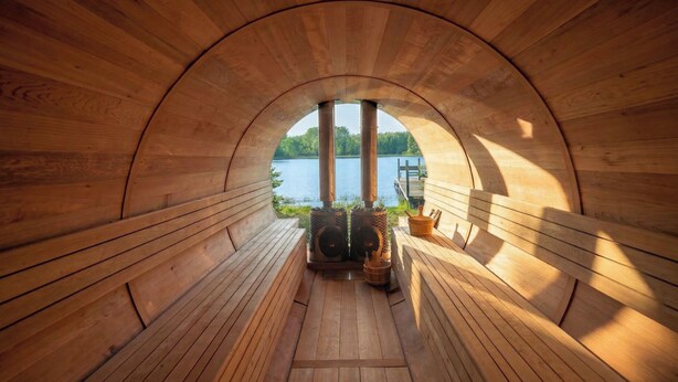 A wooden sauna with a view of a lake. - Horizons Sandhills (Patrick)