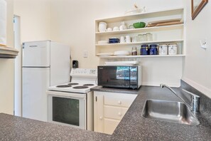 Fridge, microwave, coffee/tea maker, toaster - Trailside Escape - Lake Taupo Holiday Home (Turangi)