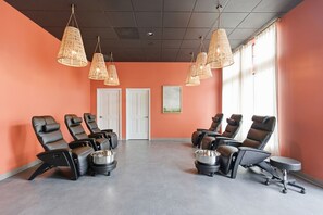 A room with multiple massage chairs, a white door, and a large window. - The Dundee - A Trace Hotel (Dundee)