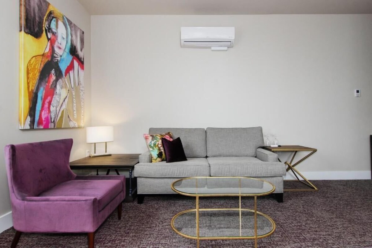Junior King Suite | Living area | 55-inch TV with cable channels
