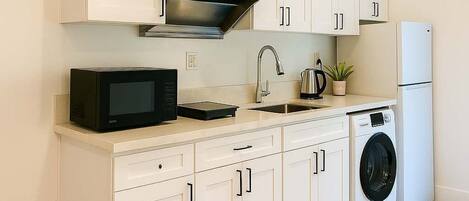 Fridge, microwave, cookware/dishes/utensils